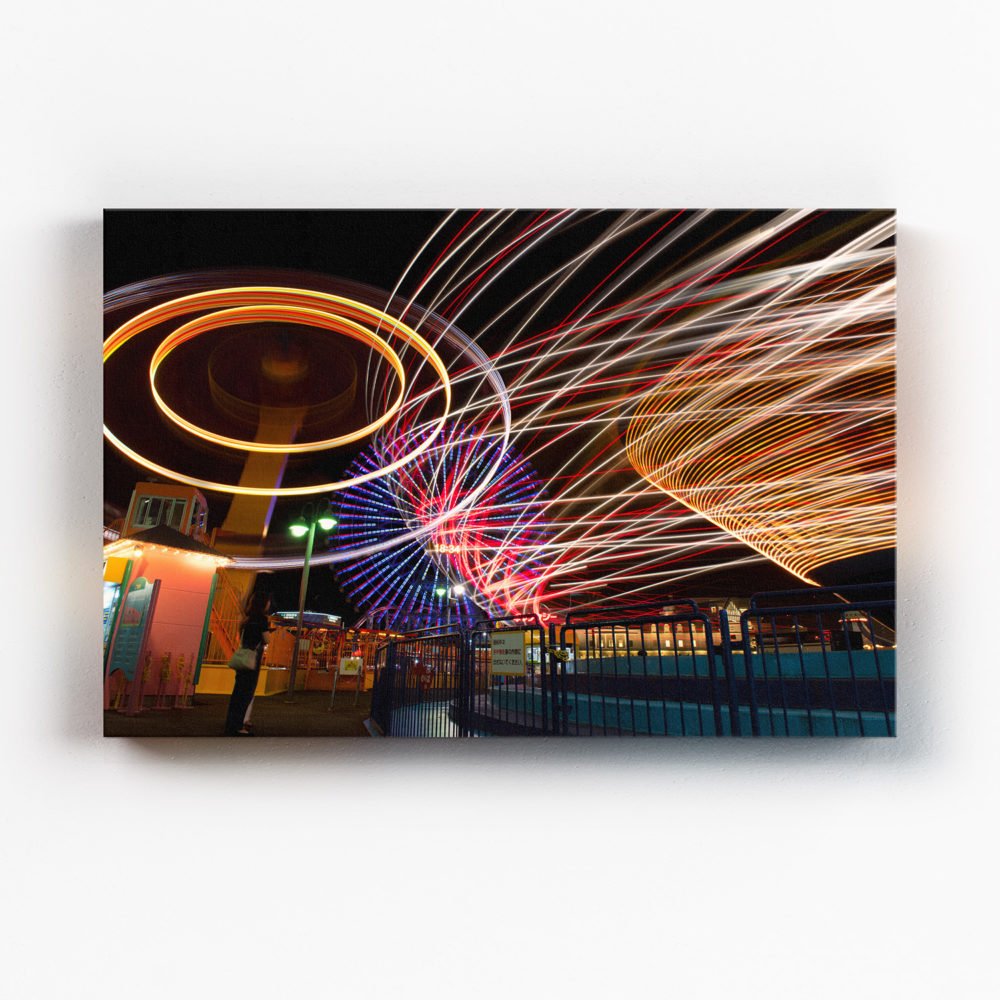 Canvas print of the rides at Cosmoworld in full swing