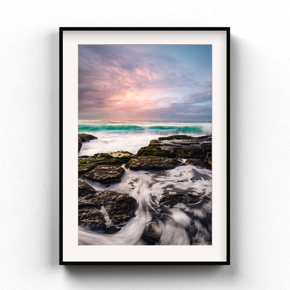 Framed Art Print of a turquoise wave approaching the rocks at Shelly Beach, Ballina
